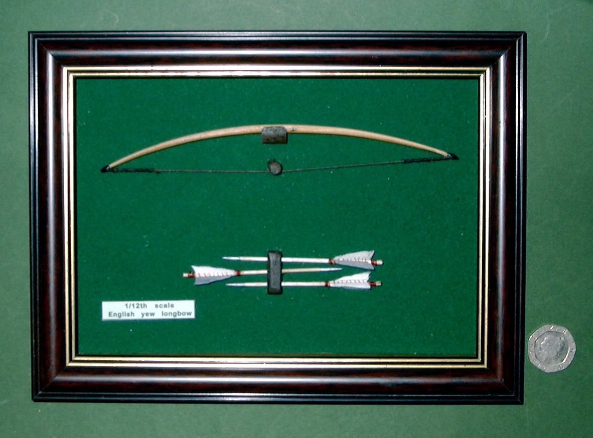 miniature bow and arrows in frame